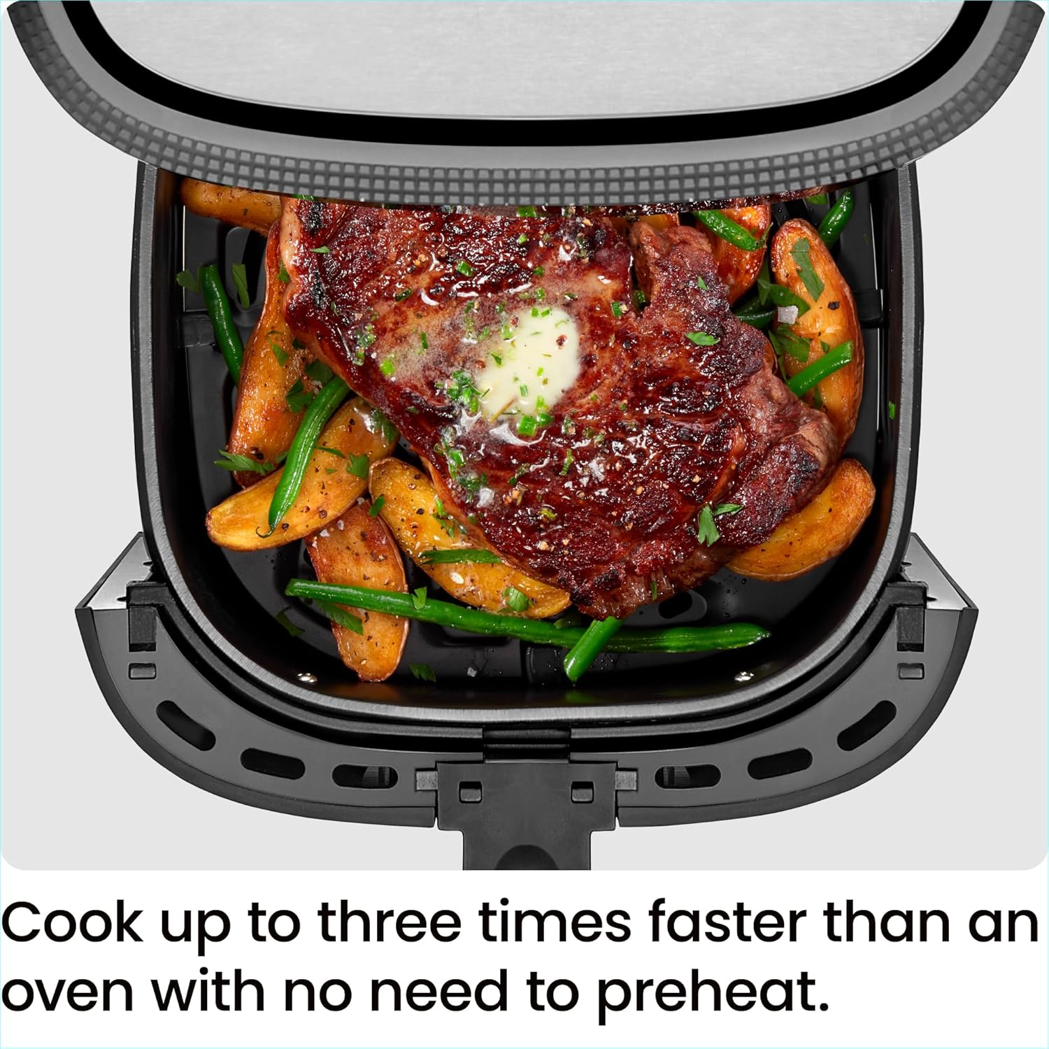 Chefman TurboFry Touch air fryer top view cooking steak and vegetables
