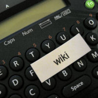 Close-up of a handheld label maker printing a small label