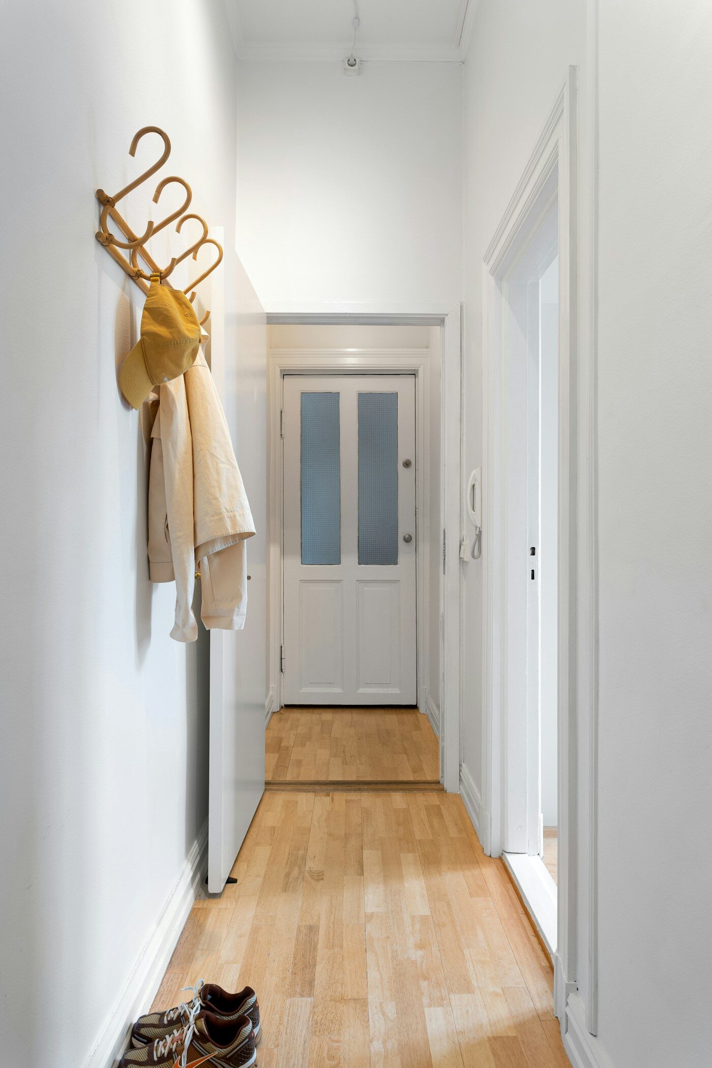 Small entryway hallway with shoes for comparing shoe storage fit
