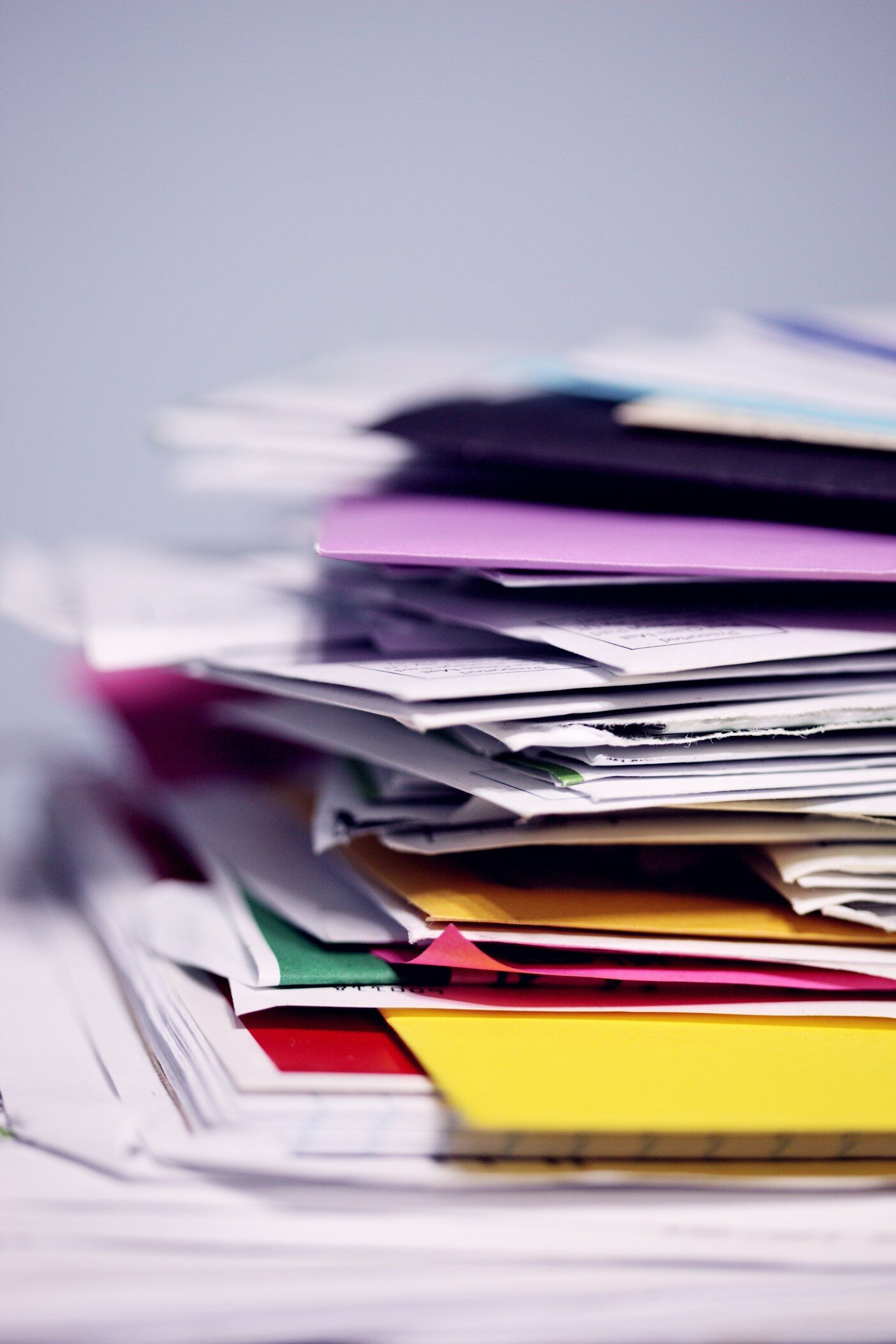 Stack of paperwork for comparing home office document scanner feeder capacity