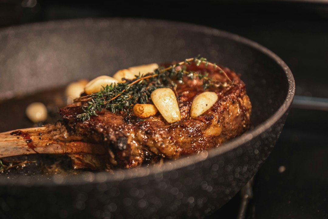 Seared steak on a plate showing the finishing stage after precise low-temperature cooking