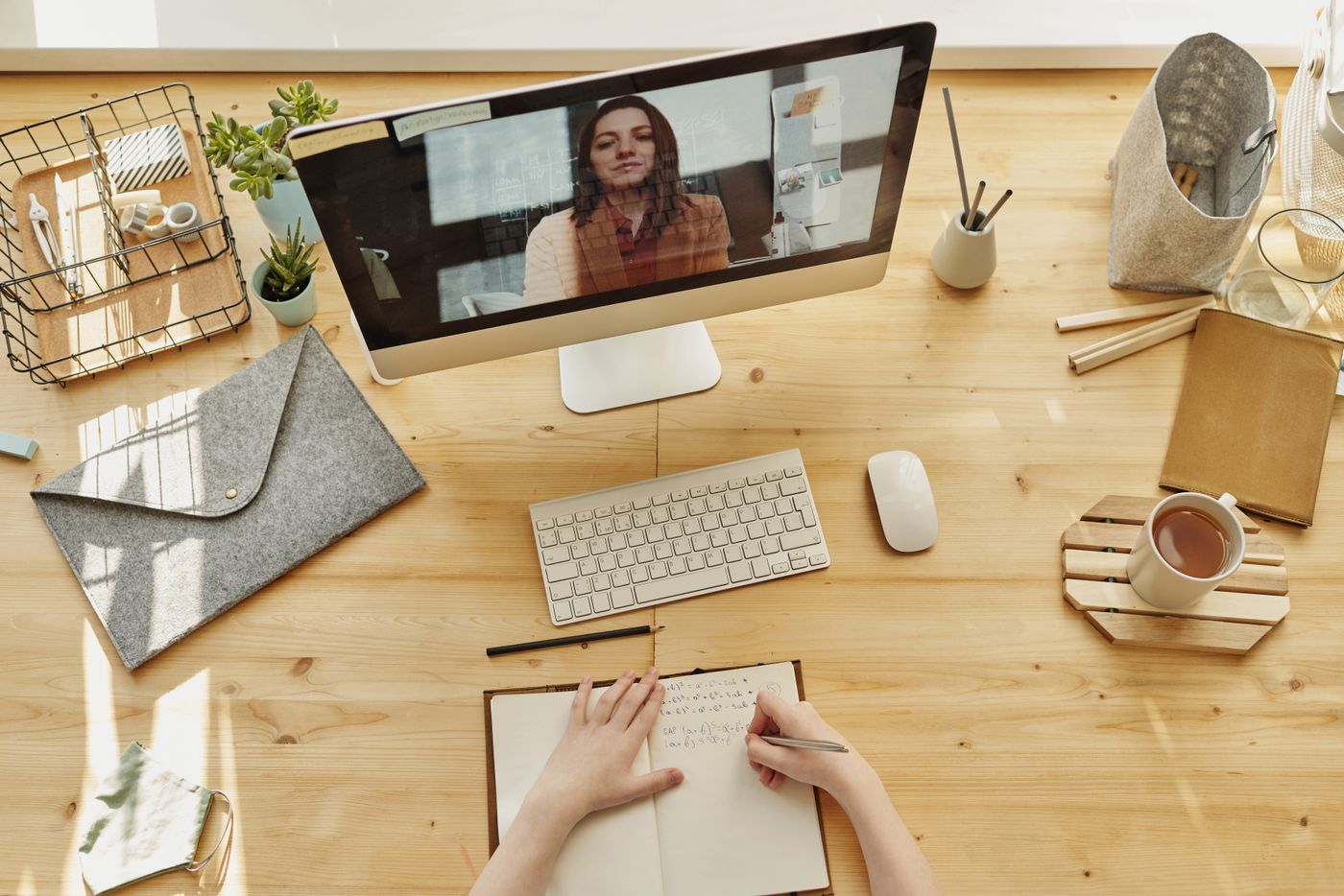 Person participating in a video call from a home workspace